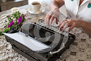 Writing concept. Typing on retro typewriter.