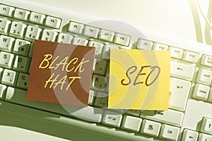 Writing displaying text Black Hat Seo. Word for Search Engine Optimization using techniques to cheat browsers Lady in