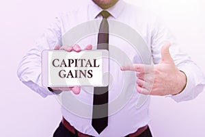 Writing displaying text Capital Gains. Business overview Bonds Shares Stocks Profit Income Tax Investment Funds