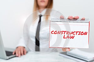 Writing displaying text Construction Law. Business overview deals with matters relating to building and related fields