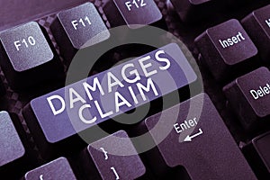 Writing displaying text Damages Claim. Business overview Demand Compensation Litigate Insurance File Suit