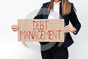 Writing displaying text Debt ManagementThe formal agreement between a debtor and a creditor. Internet Concept The formal