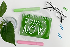 Writing displaying text Donate Now. Internet Concept to give something like money or goods to a charity or any cause