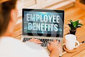 Writing displaying text Employee Benefits. Concept meaning Indirect and noncash compensation paid to an employee Woman photo