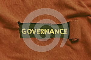 Writing displaying text Governance. Business overview exercised in handling an economic situation in a nation