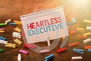 Writing displaying text Heartless Executive. Business idea workmate showing a lack of empathy or compassion Thinking New