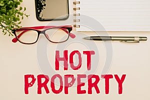 Writing displaying text Hot Property. Word for Something which is sought after or is Heavily Demanded Office Supplies