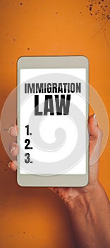 Writing displaying text Immigration Law. Concept meaning national statutes and legal precedents governing immigration