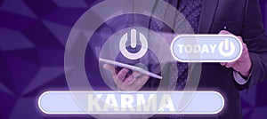 Writing displaying text Karma. Internet Concept sum of a person actions in this and previous states of existence