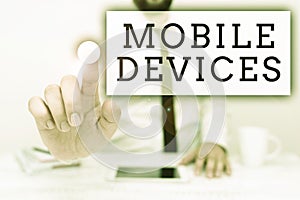 Writing displaying text Mobile Devices. Business approach A portable computing device like smartphone tablet computer
