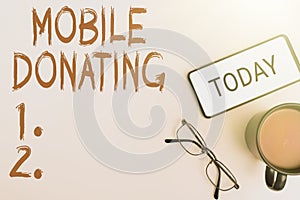 Writing displaying text Mobile Donating. Internet Concept to give something to a charity or any cause using personal
