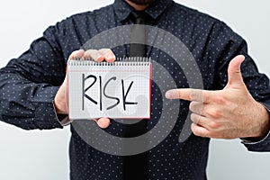 Writing displaying text Risk. Business concept Possibility of losing something of value or threat of damage Presenting