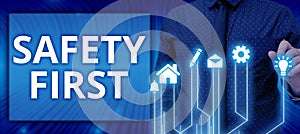 Writing displaying text Safety First. Business showcase Avoid any unnecessary risk Live Safely Be Careful Pay attention