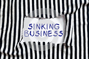 Writing displaying text Sinking Business. Business showcase the company or other organization that is failing