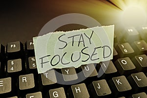 Writing displaying text Stay Focused. Business overview Be attentive Concentrate Prioritize the task Avoid distractions
