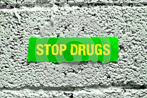 Writing displaying text Stop Drugs. Business approach the process of discontinuing or quitting tobacco smoking