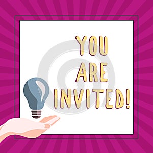 Writing displaying text You Are Invited. Concept meaning Receiving and invitation for an event Join us to celebrate