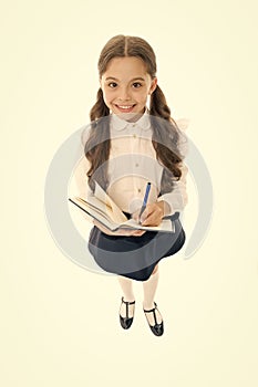 Writing essay. Girl with copy book or workbook. Kid perfect student ready with homework. School girl excellent pupil