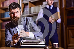 Writing and fees concept. Man in oldfashioned suit holds money.