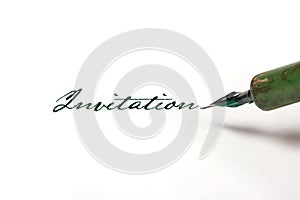 Writing invitation with quill pen photo