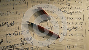 Writing Music Concept - Ink Pen On Sheet Music