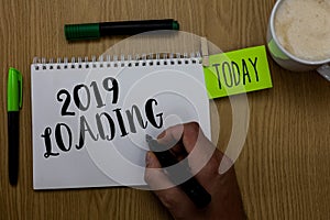 Writing note showing 2019 Loading. Business photo showcasing Advertising the upcoming year Forecasting the future event Man holdin