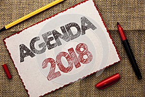 Writing note showing Agenda 2018. Business photo showcasing Strategy Planning Things Schedule Future Goals Organize written on Ca
