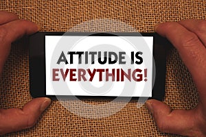 Writing note showing Attitude Is Everything. Business photo showcasing Personal Outlook Perspective Orientation Behavior Man hold photo