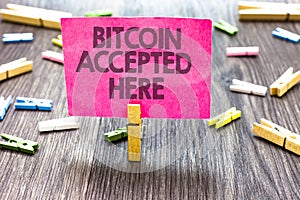 Writing note showing Bitcoin Accepted Here. Business photo showcasing you can purchase things through Cryptocurrencies Multiple cl