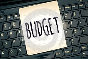 Writing note showing Budget. Business photo showcasing defined estimate of income and expenditure for set period of time