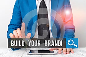 Writing note showing Build Your Brand. Business photo showcasing creates or improves customers knowledge and opinions of