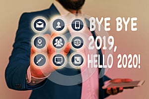 Writing note showing Bye Bye 2019 Hello 2020. Business photo showcasing saying goodbye to last year and welcoming