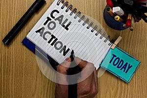 Writing note showing Call To Action. Business photo showcasing Encourage Decision Move to advance Successful strategy Man holding