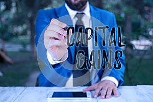 Writing note showing Capital Gains. Business photo showcasing Bonds Shares Stocks Profit Income Tax Investment Funds