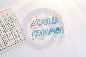 Writing note showing Career Development. Business photo showcasing Lifelong learning Improving skills to get a better job White pc
