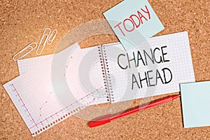 Writing note showing Change Ahead. Business photo showcasing the act or instance of making or becoming different or Desk