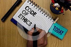 Writing note showing Code Of Ethics. Business photo showcasing Moral Rules Ethical Integrity Honesty Good procedure Man holding ma