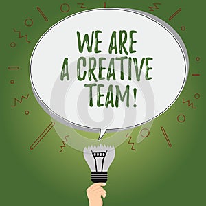 Writing note showing We Are A Creative Team. Business photo showcasing Creativity teamwork colleagues brainstorm working