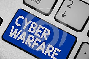 Writing note showing Cyber Warfare. Business photo showcasing Virtual War Hackers System Attacks Digital Thief Stalker Keyboard bl