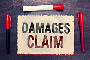 Writing note showing Damages Claim. Business photo showcasing Demand Compensation Litigate Insurance File Suit Open notebook page photo