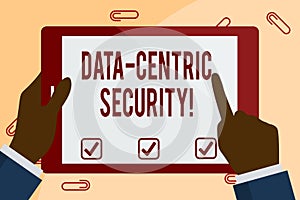 Writing note showing Data Centric Security. Business photo showcasing Identify and protect data wherever it resides Hand