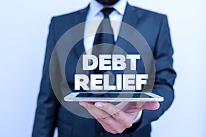 Writing note showing Debt Relief. Business photo showcasing partial or total remission of it especially those by