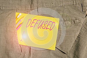 Writing note showing Defused. Business photo showcasing make a difficult or dangerous situation calmer by reducing its cause