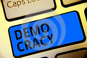 Writing note showing Demo Cracy. Business photo showcasing freedom of the people to express their feelings and beliefs Keyboard bl