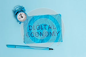 Writing note showing Digital Economy. Business photo showcasing worldwide network of economic activities and