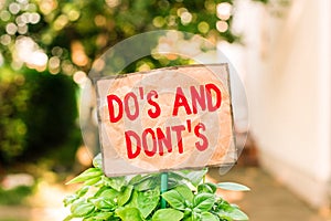 Writing note showing Do S And Dont S. Business photo showcasing Rules or customs concerning some activity or actions Plain paper