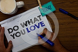 Writing note showing Do What You Love. Business photo showcasing Make enjoyable things do activities with motivation Hand hold pen