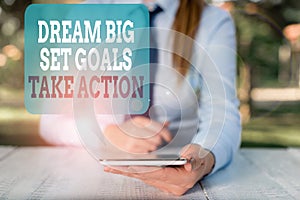 Writing note showing Dream Big Set Goals Take Action. Business photo showcasing Motivation to follow your dreams