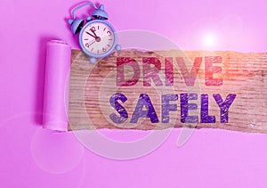 Writing note showing Drive Safely. Business photo showcasing you should follow the rules of the road and abide laws