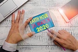 Writing note showing Earth Hour 24 March 2020. Business photo showcasing Celebrate Sustainability Save the Planet Lights